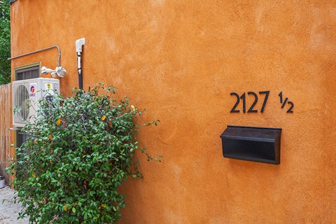 A wall with the number 2127 on it.