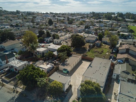 A bird's eye view of a residential area with houses and trees.