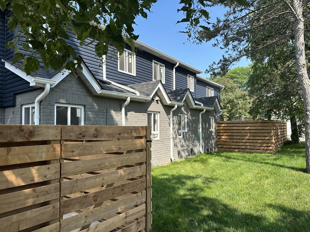 a house with a wooden fence