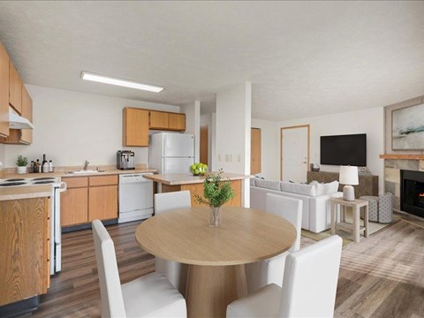 A modern kitchen with a dining table and chairs.