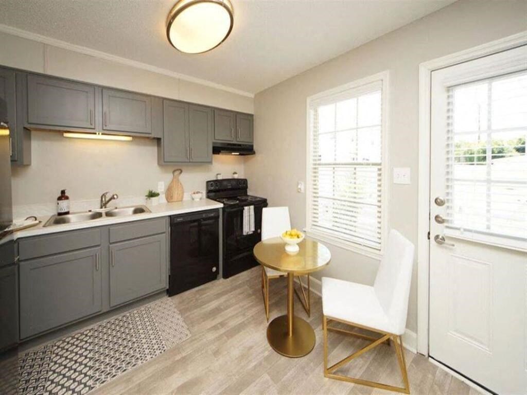 a small kitchen with a small table in the middle