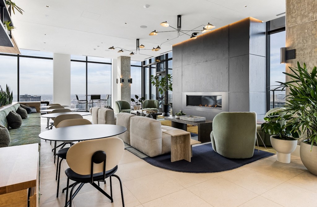 a rendering of a living room with furniture and a fireplace