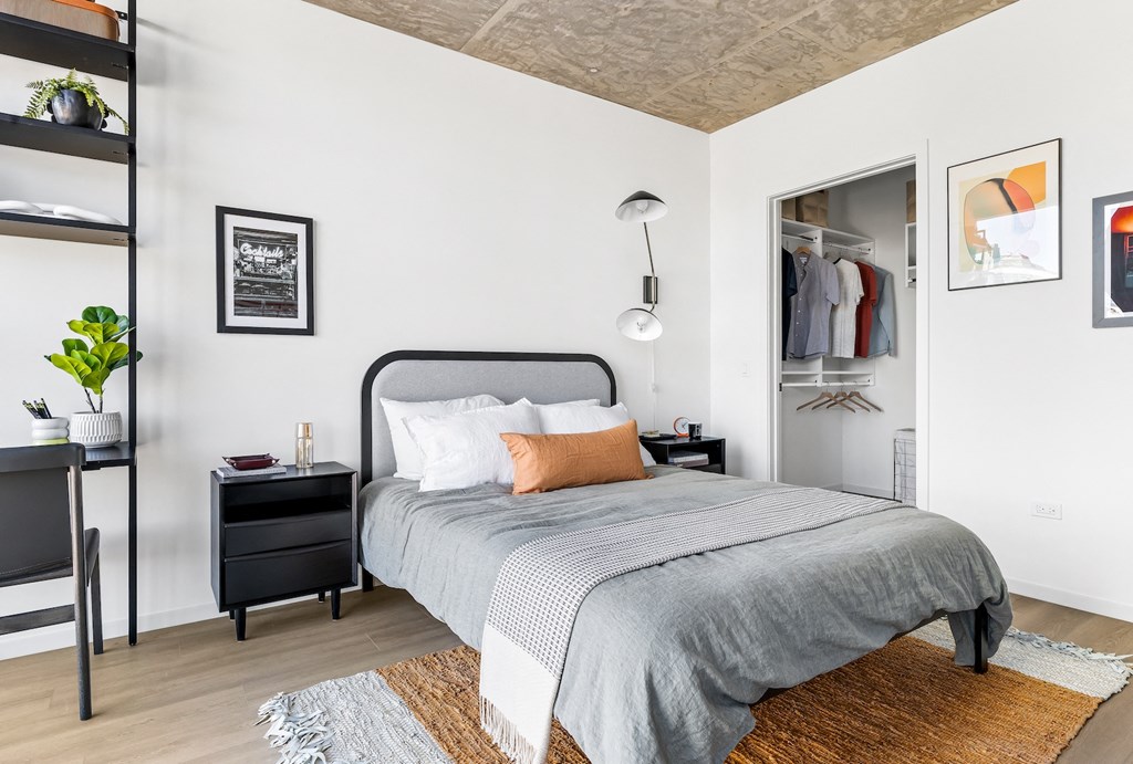 a bedroom with a bed and a closet