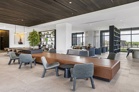 a conference room with a large wooden table and chairs