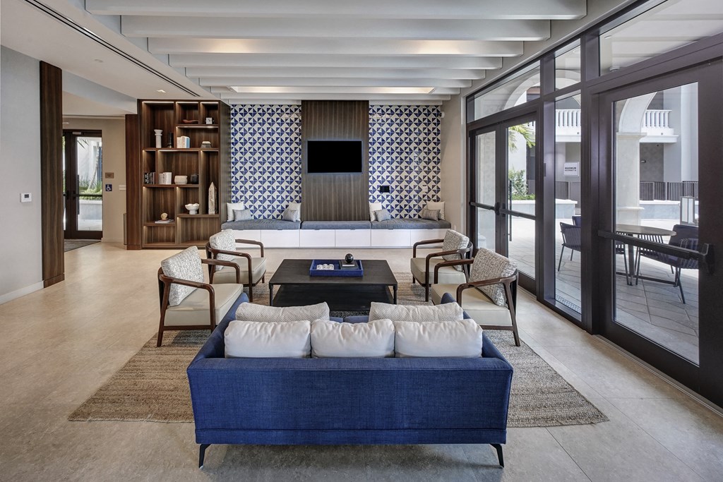 a living room with a blue couch and a coffee table