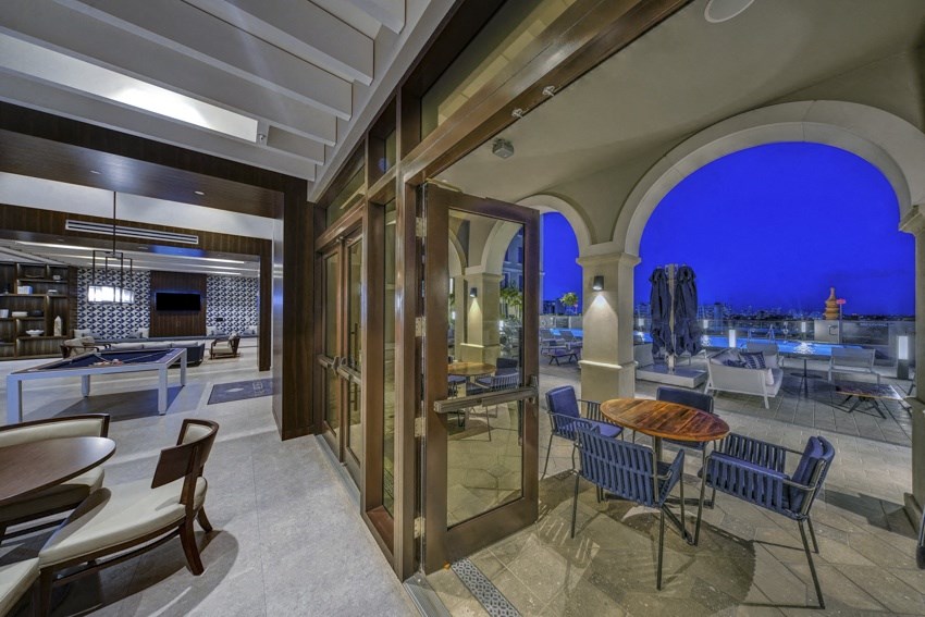 a restaurant with a view of the city at night