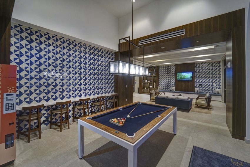 a game room with a pool table and ping pong