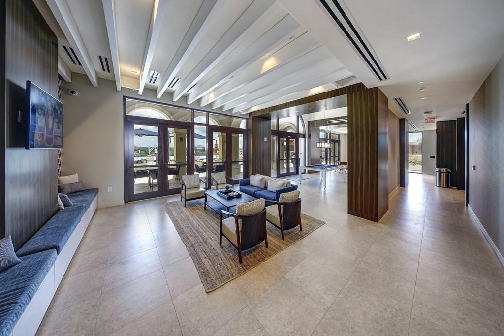 the lobby of a hotel with couches and chairs
