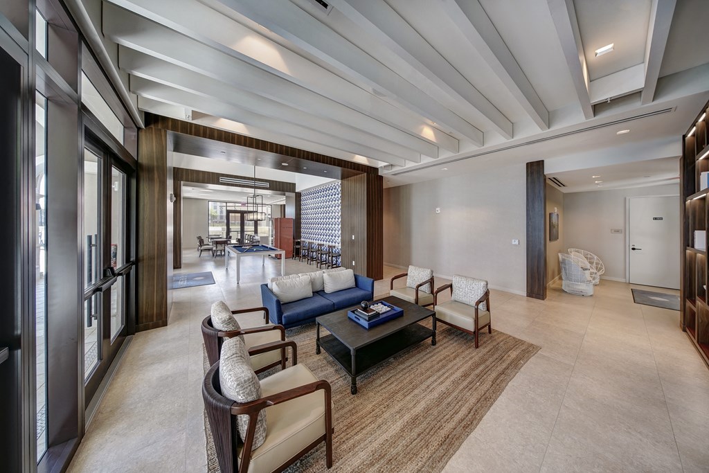 a living room with couches and chairs and a coffee table