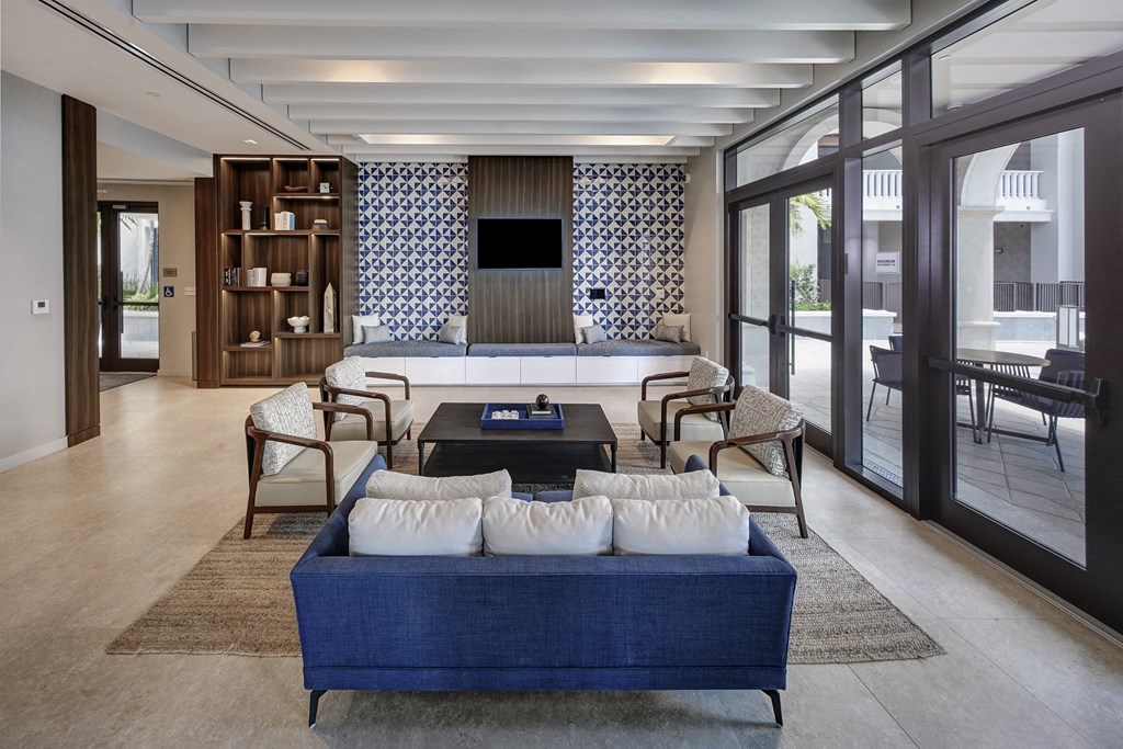 a living room with a blue couch and a coffee table