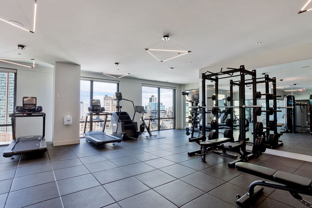 a gym with exercise equipment and a view of the city at Platform 4611, Illinois, 60640