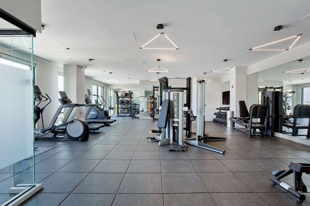 a gym with treadmills and other exercise equipment at Platform 4611, Illinois