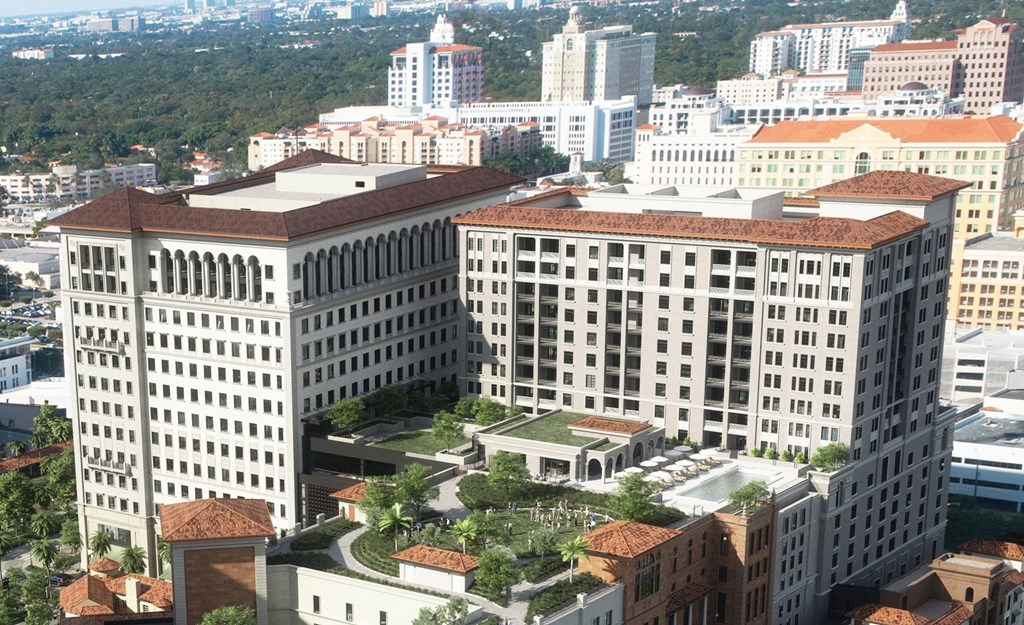 an aerial view of a city with tall buildings