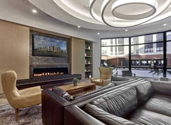a living room with a fireplace and a large window