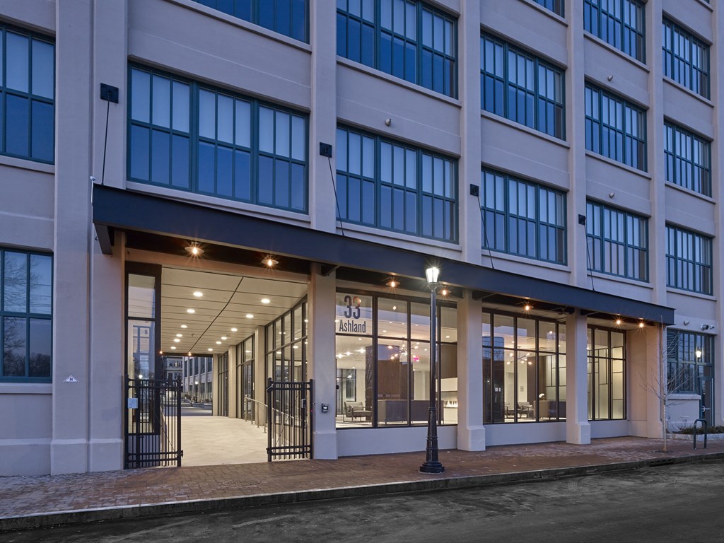 A building with a black gate in front of it.