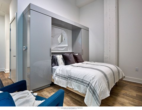 a bedroom with a bed and a closet
