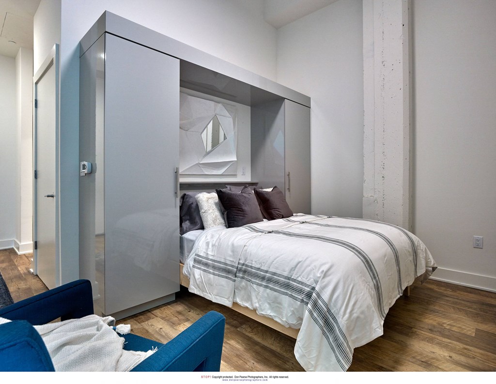 a bedroom with a bed and a closet