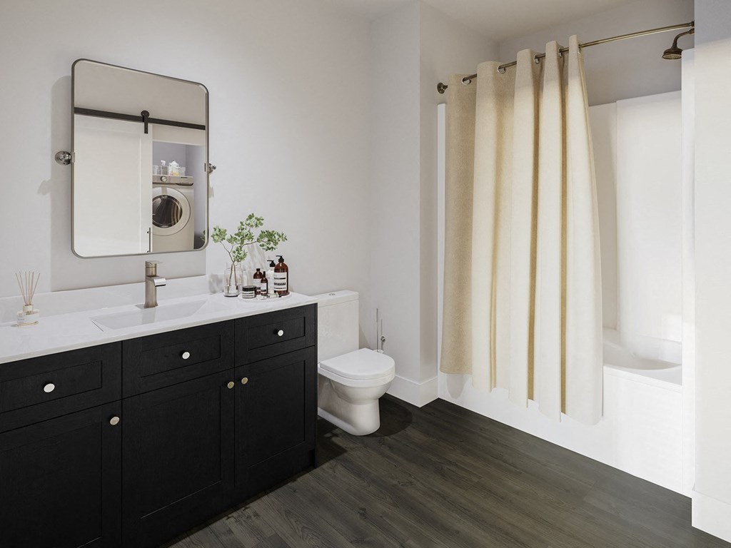 a bathroom with a toilet and a sink and a mirror
