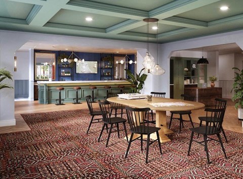 a dining room with a table and chairs