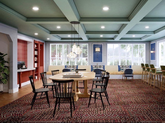 a large dining room with a table and chairs