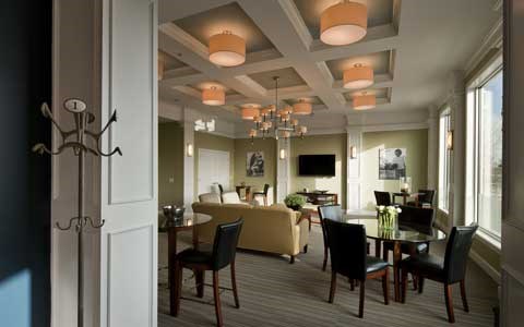 A dining room with a table set for six.