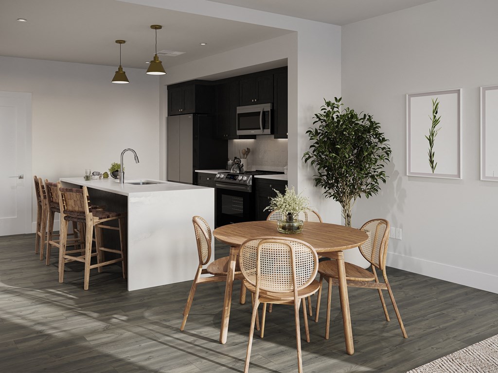 a kitchen and dining room with a table and chairs