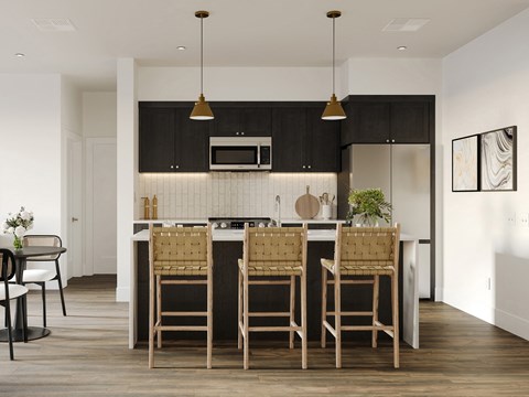 a kitchen with an island and chairs in a modern apartment