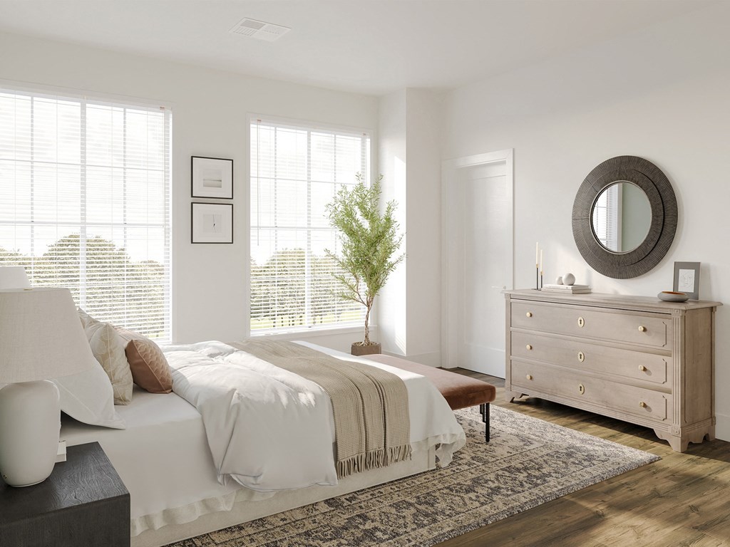 a bedroom with a bed and a dresser