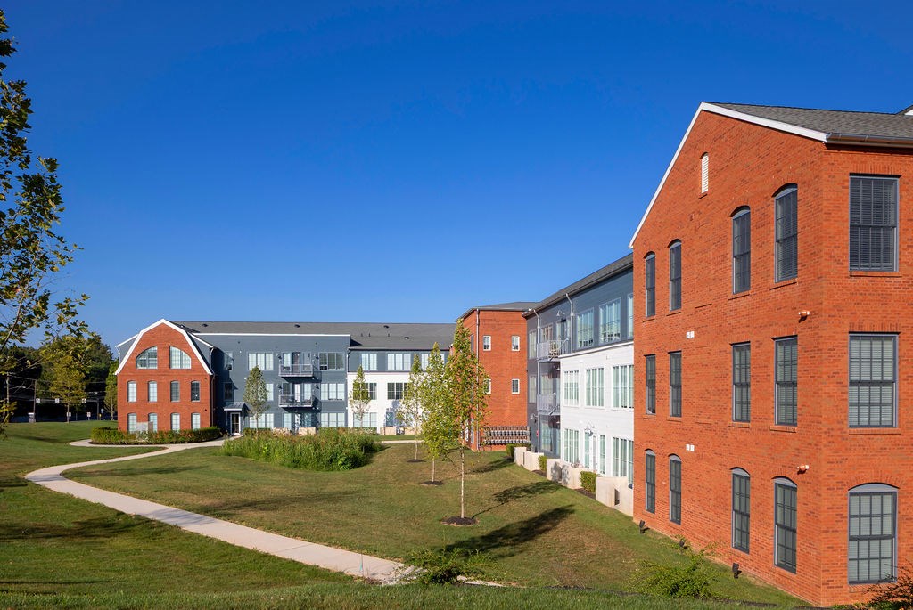 A red brick building with a clear blue sky in the background.