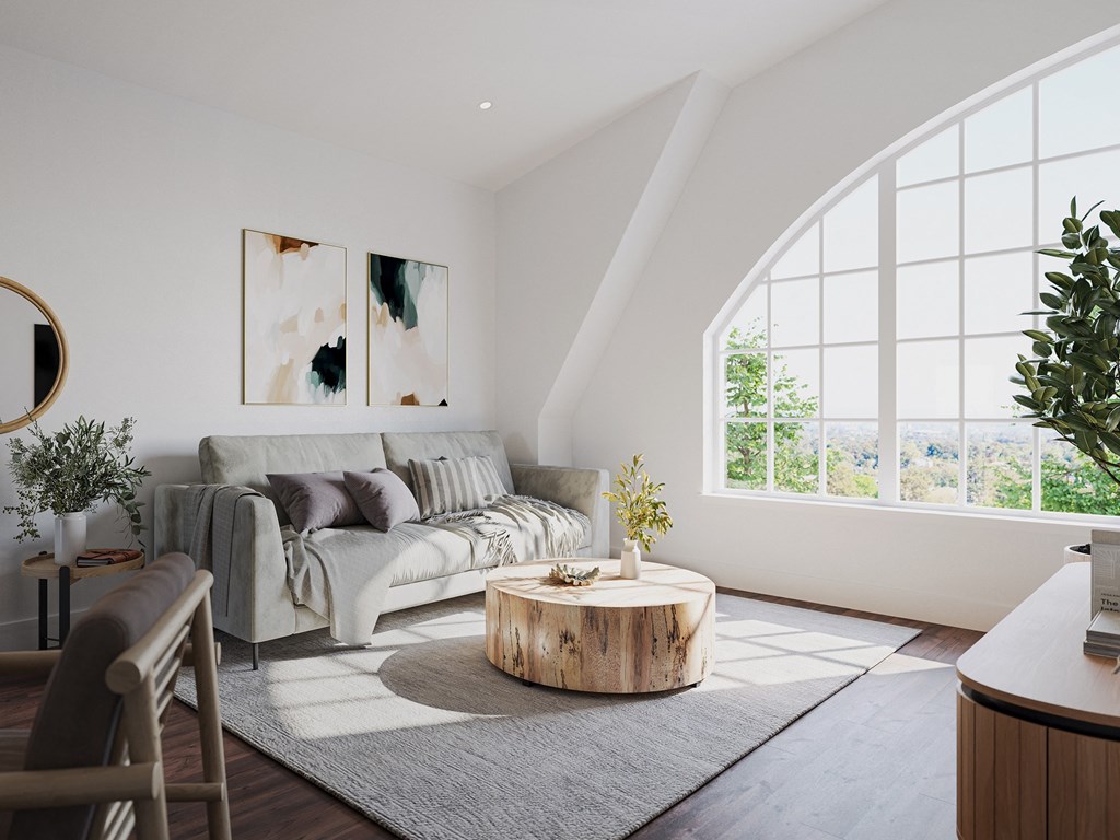 a living room with a couch and a round coffee table