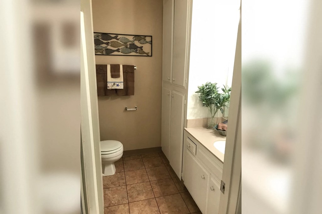 a bathroom with a toilet and a sink