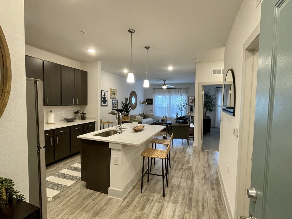 a kitchen and living room with a large island