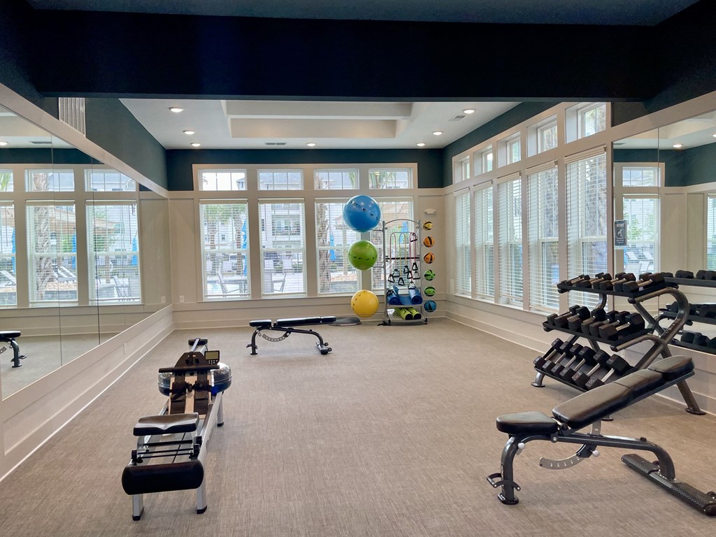 area of fitness center for calisthenics, yoga, stretching, or private workouts