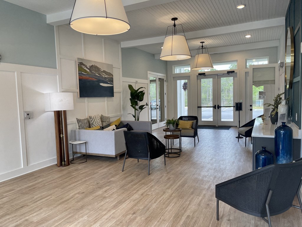 a living room with couches and chairs