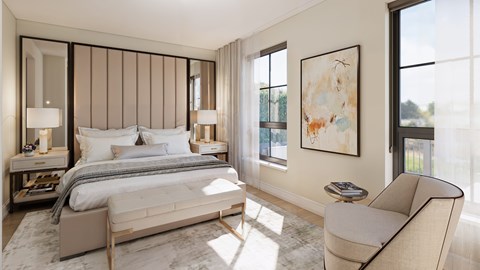 A bedroom with a large bed, a chair, and a painting on the wall.