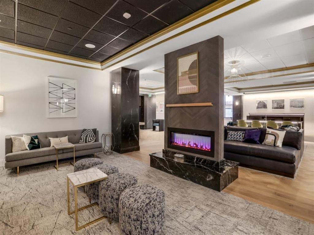 a living room with a fireplace and couches