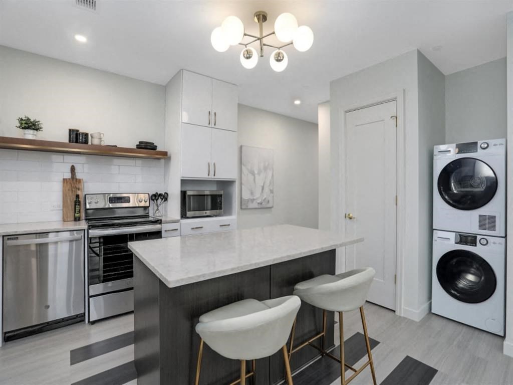 a kitchen with a counter top and a washing machine