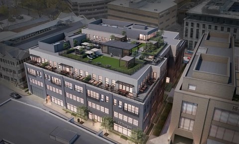 A rendering of a modern building with a green roof and multiple floors.