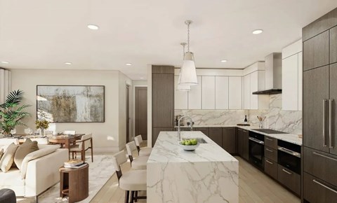 A modern kitchen with a marble countertop and a dining area with a white sofa and chairs.