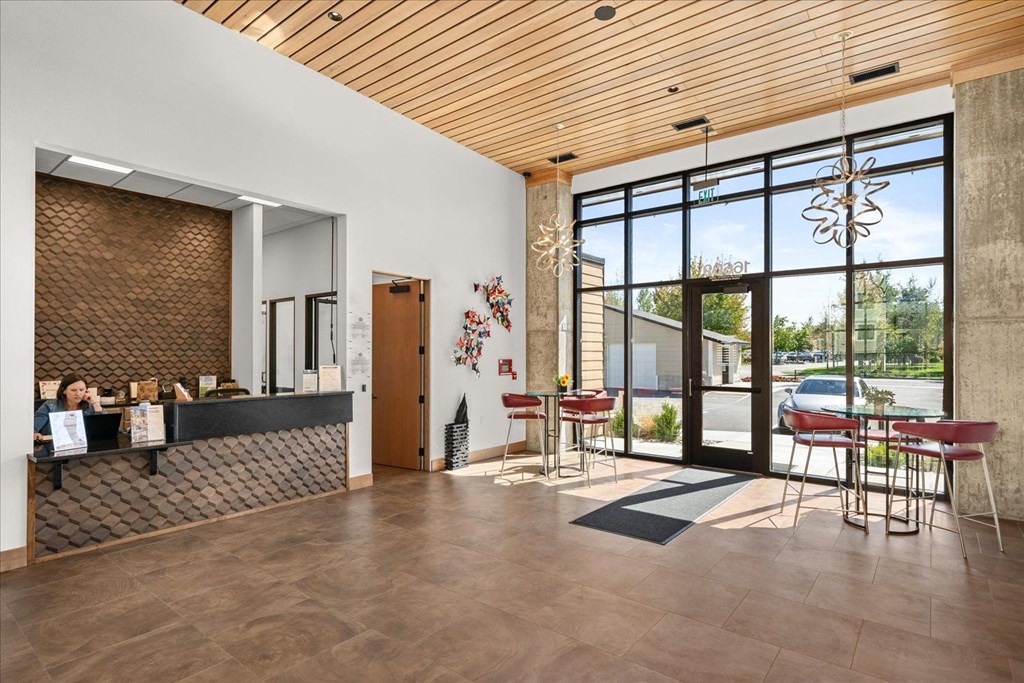 a living room with a bar and a large glass door