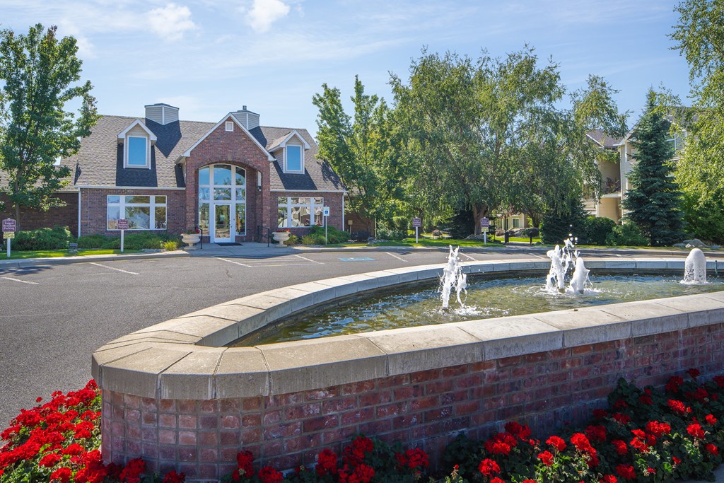 a fountain in front of a house