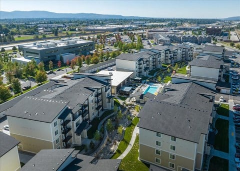 an aerial view of apartments in a city with a pool