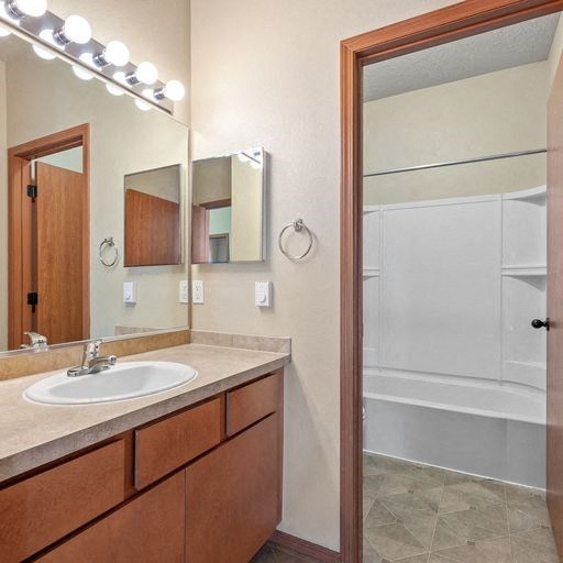 a bathroom with a sink and a bathtub