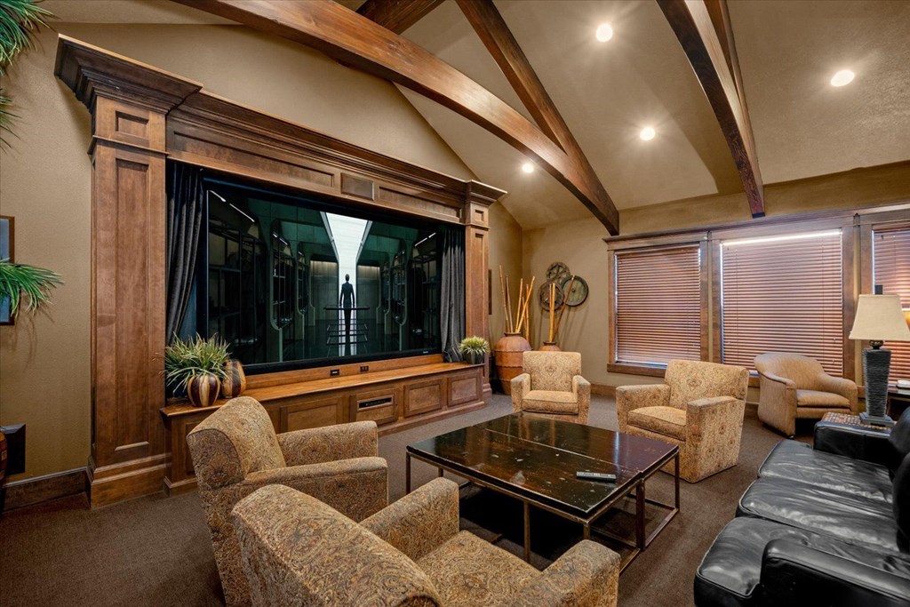 a living room with a large window and a table