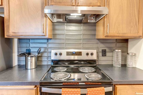 a kitchen with a stove and a microwave