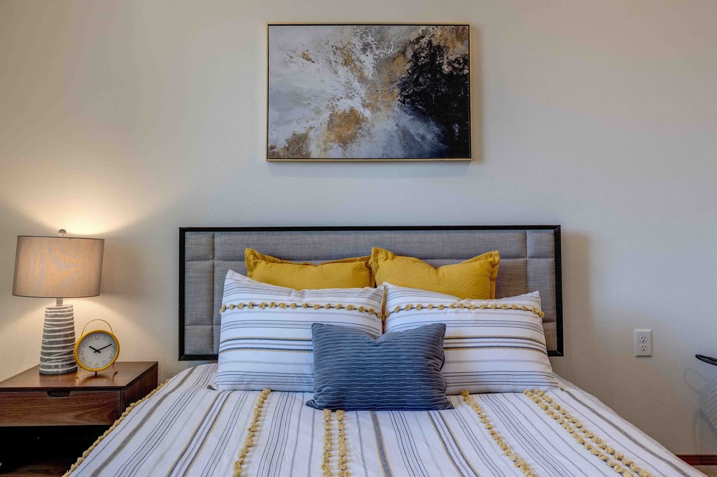 a bedroom with a bed and a nightstand