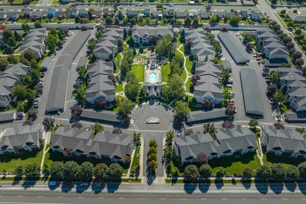 an aerial view of a neighborhood with houses and trees