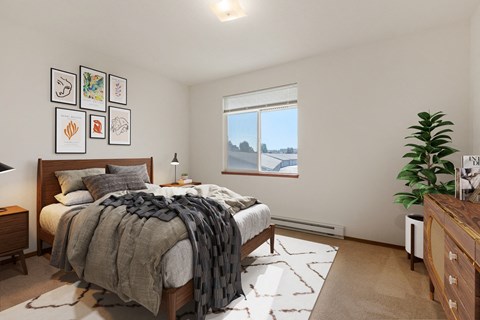 a bedroom with a large bed and a window