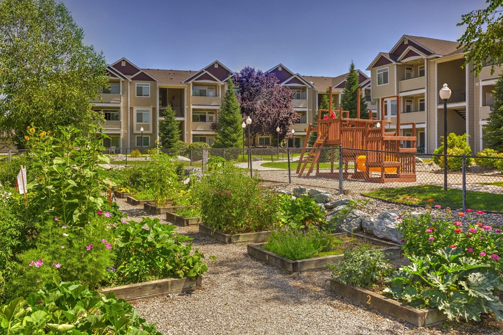 a community garden in front of an apartment building