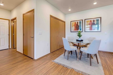 a dining room with a table and chairs